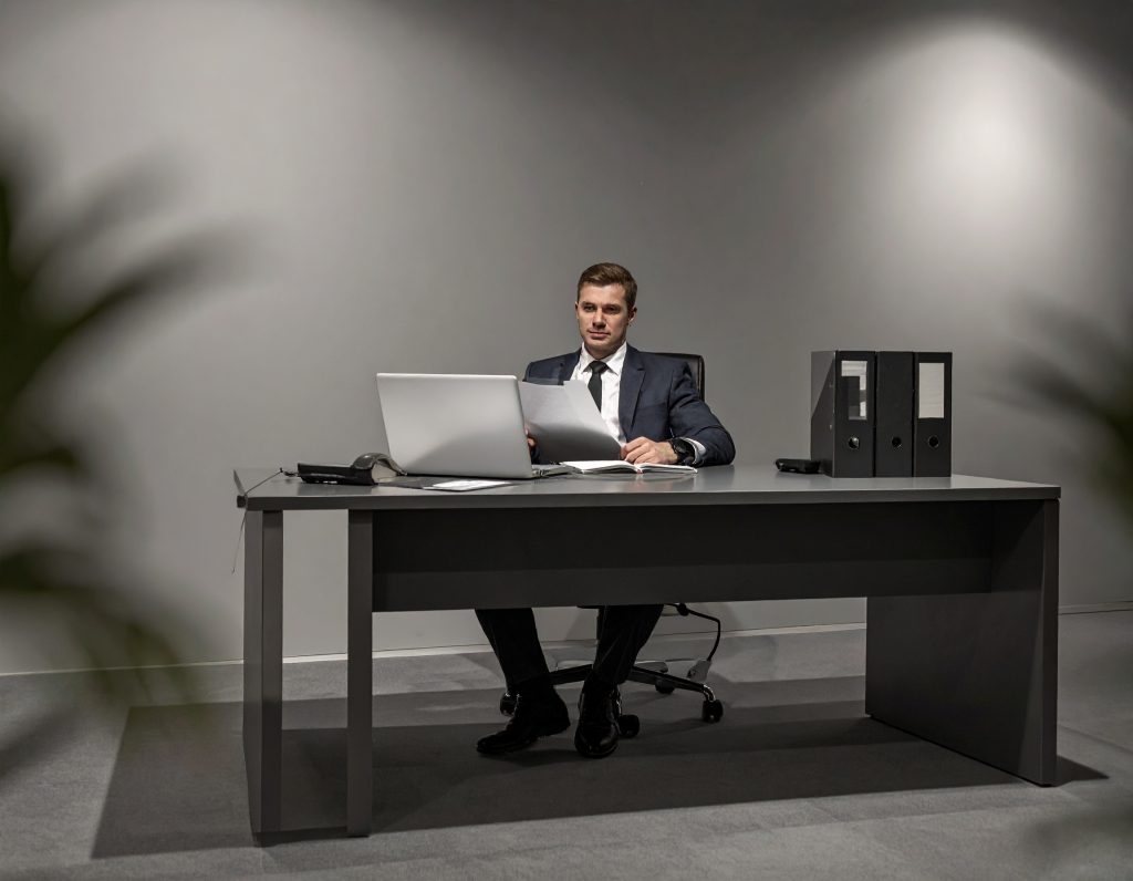 Underwriter reviewing submission documents on laptop